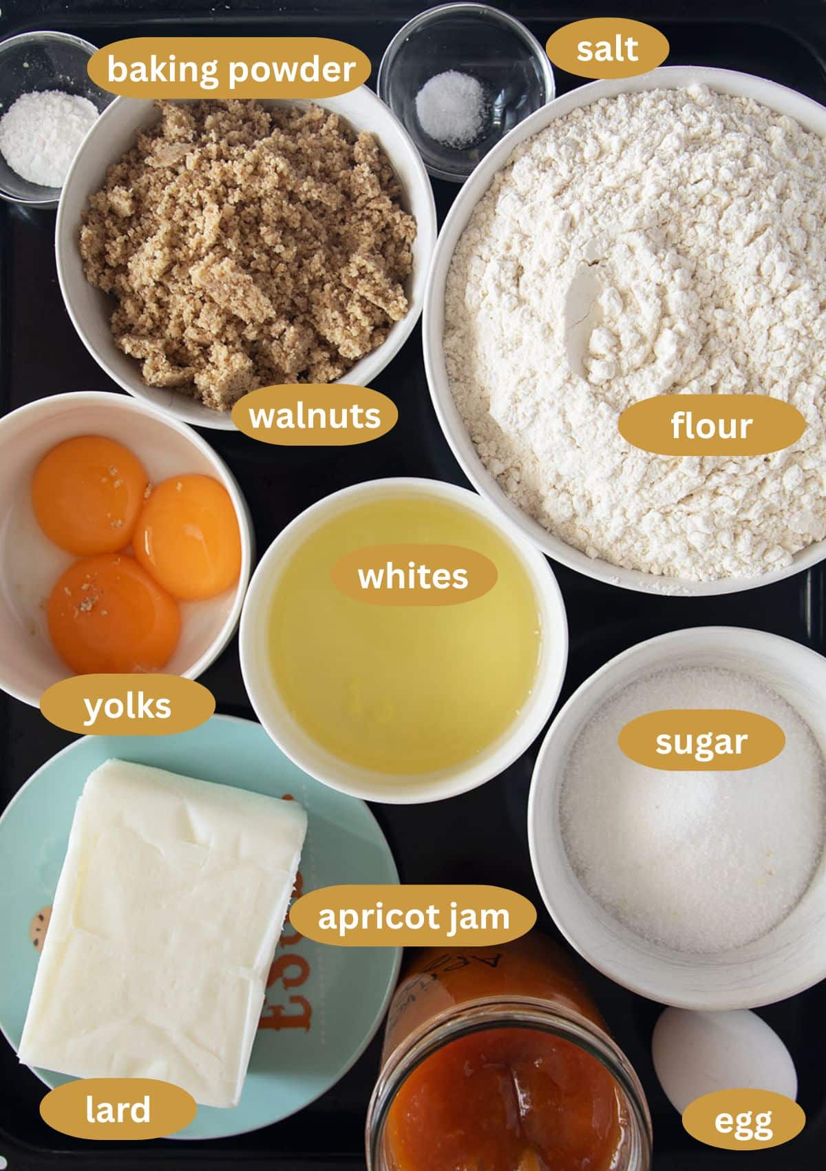 labeled ingredients for making romanian cake with apricot jam and walnuts.