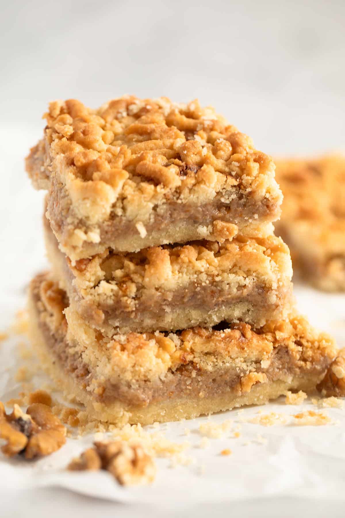 three stapled pieces of cake with apricot jam.