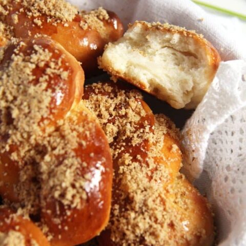 fluffy romanian pastries sprinkled with walnuts in a basket