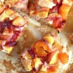 slices of peach cake on baking parchment.