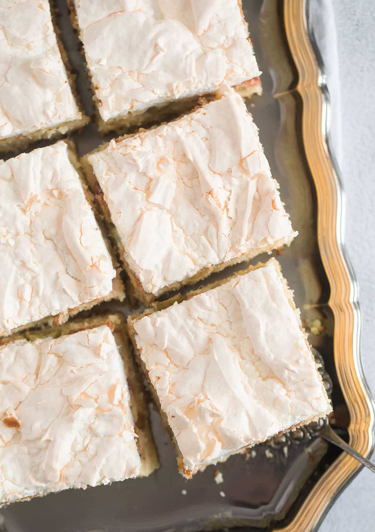 square cake slices with meringue on a vintage platter.