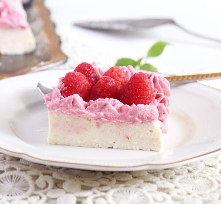 no bake ricotta cheesecake with rasperries on a vintage plate