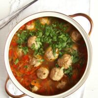 meatball vegetable soup in a soup pot