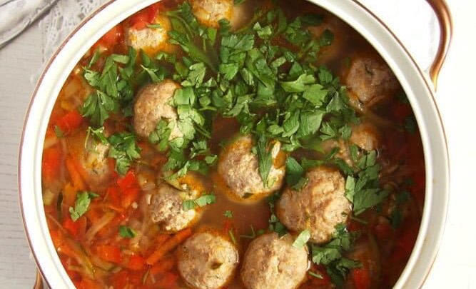meatball vegetable soup in a soup pot