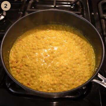 simmering turmeric sauce for pasta with chickpeas in a saucepan.