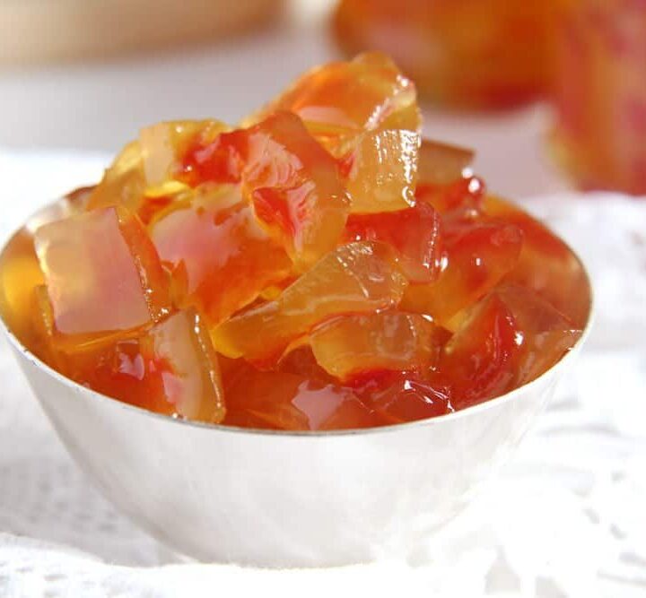 small bowl with glossy watermelon rind jam