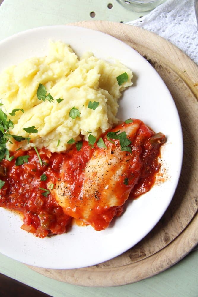 fish with tomato sauce and mashed potatoes