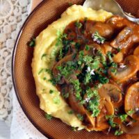 plate of mushroom stew with polenta