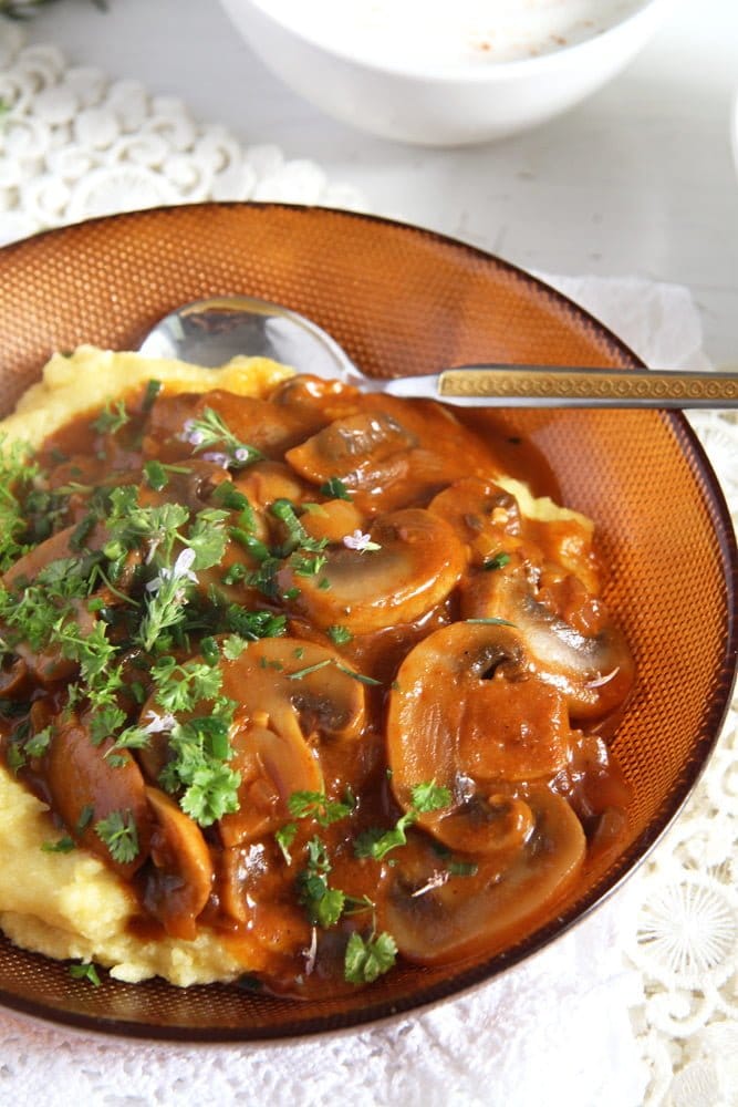 plate of mushroom stew with polenta