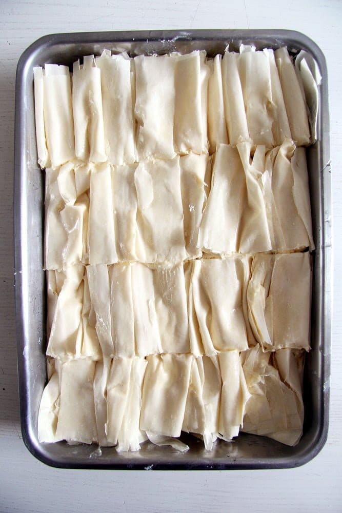 filo filled with cheese in a baking tin before baking
