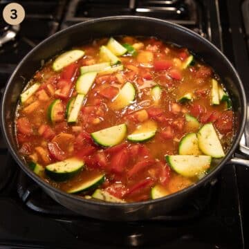 simmering rice with tomatoes, zucchini and carrots in a large saucepan.