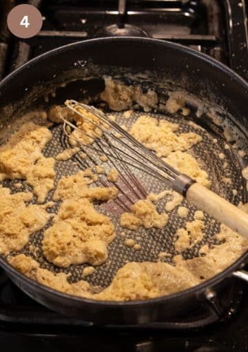 whisking flour in melted butter in a pan.