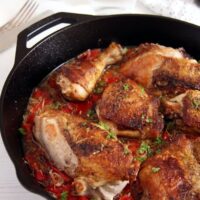 chicken in the skillet with garlic red pepper sauce