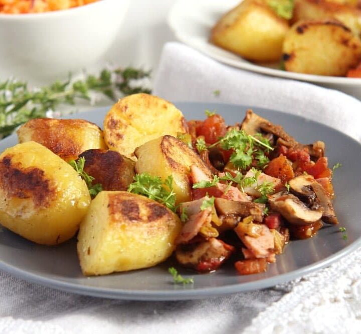 gypsy potatoes fried with bacon and ham and served with vegetables