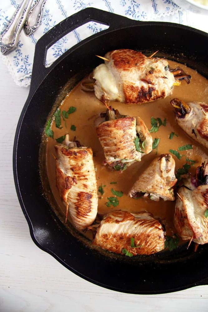 turkey rolls in the skillet stuffed with cheese and vegetables