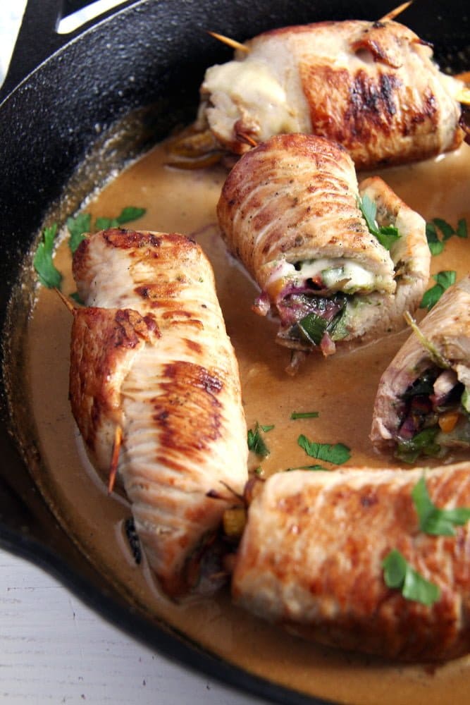 turkey rolls in the skillet stuffed with cheese and vegetables