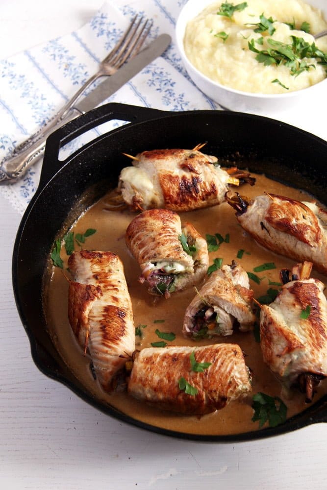 turkey rolls in the skillet stuffed with cheese and vegetables