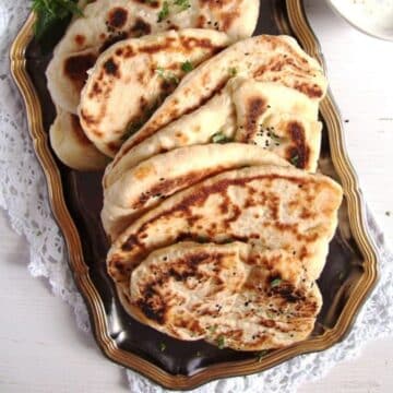 several fluffy afghan bread pieces on a vintage platter.