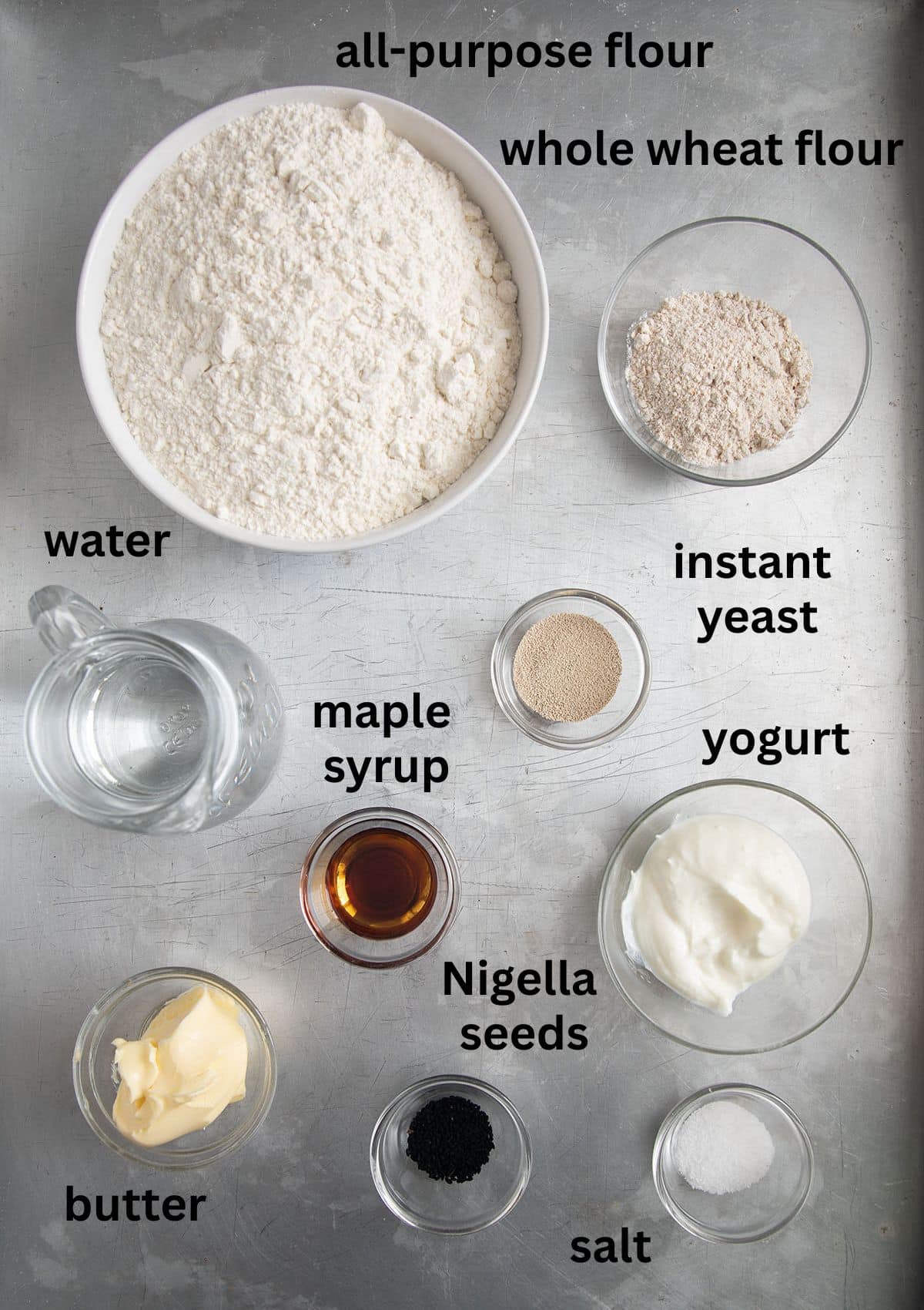 labeled ingredients for making afghan naan bread with flour, yeast, and yogurt.