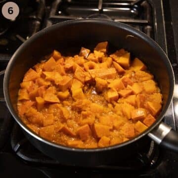 stewed pumpkin pieces in large saucepan on the stovetop.