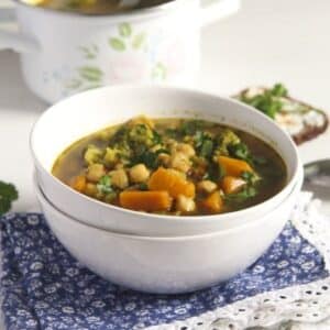 broccoli and sweet potato soup with chickpeas and herbs in a bowl.