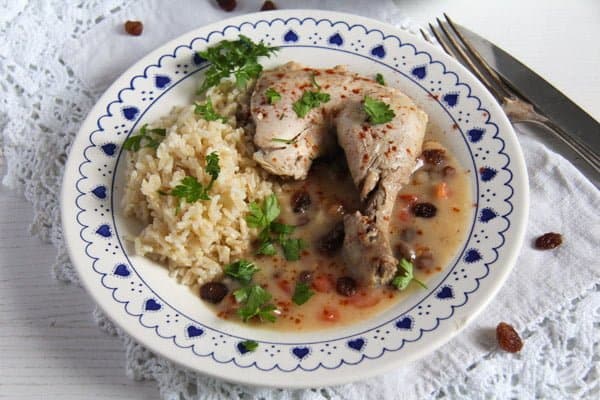 Poached Chicken in White Sauce with Raisins and Rice