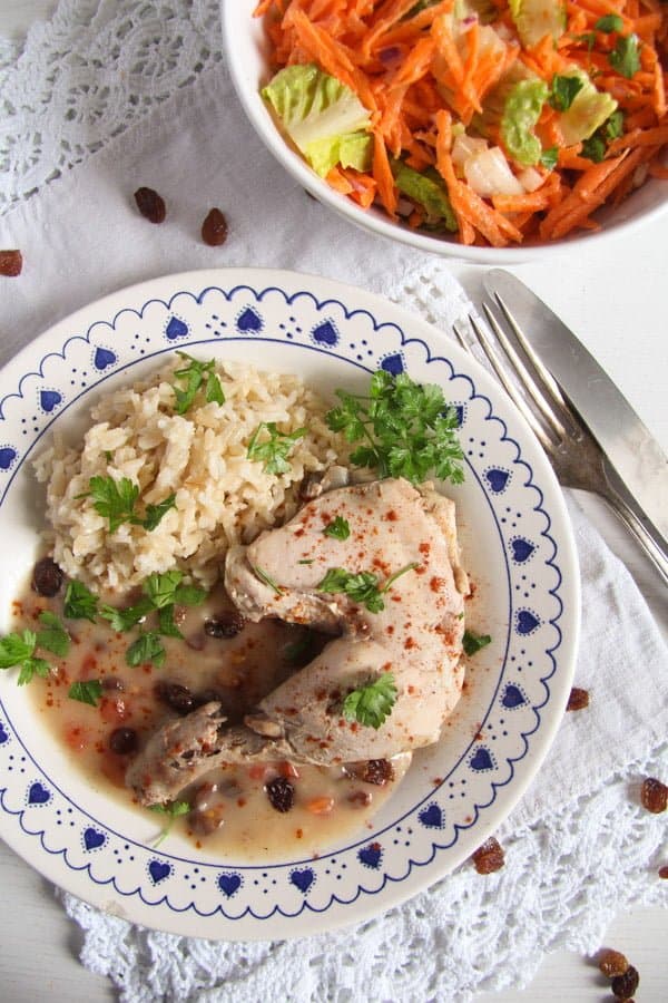 Poached Chicken in White Sauce with Raisins and Rice