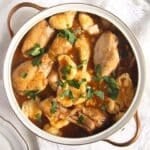 pinterest image with title of a large pot with chicken paprikash with dumplings.