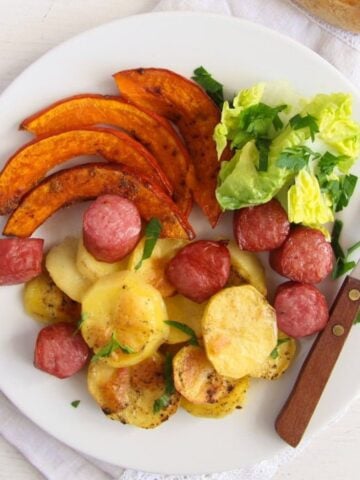potato pumpkin sausage bake served with salad