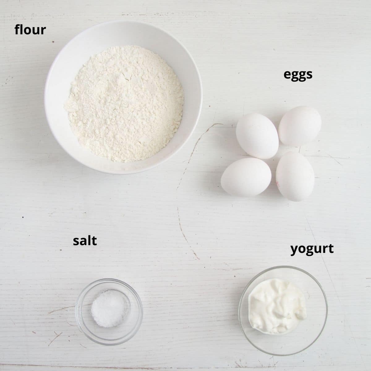 flour, eggs, salt, yogurt on the table.