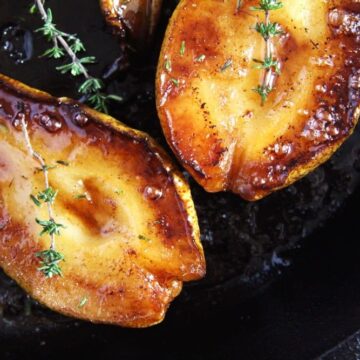 shiny roasted pears halves in skillet