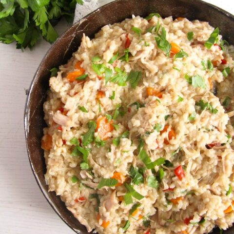 chicken rice and vegetables in large serving dish