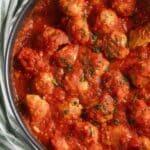 pinterest image with the title pork meatballs in tomato sauce.