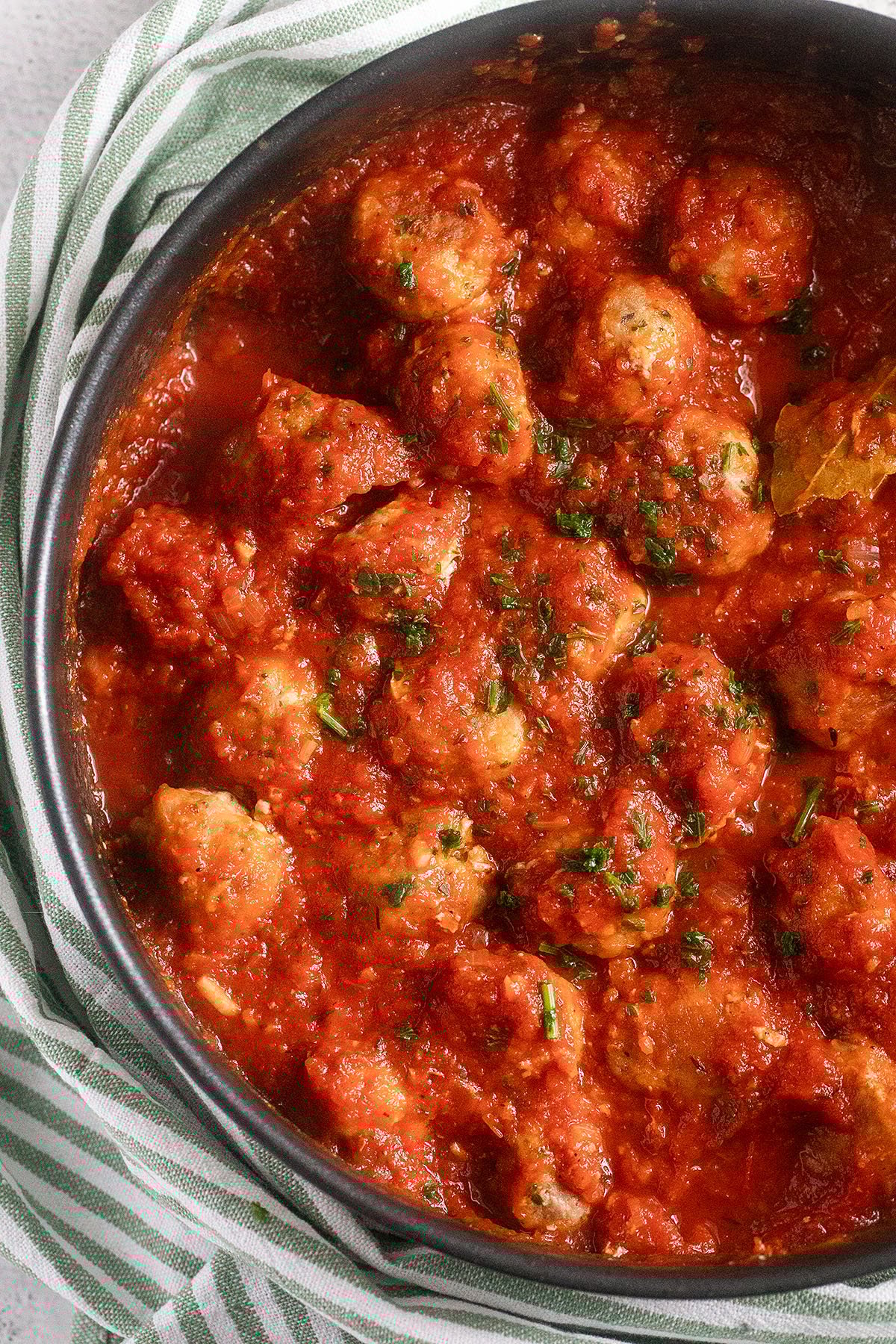 lots of small pork meatballs smothered in a delicious tomato sauce.