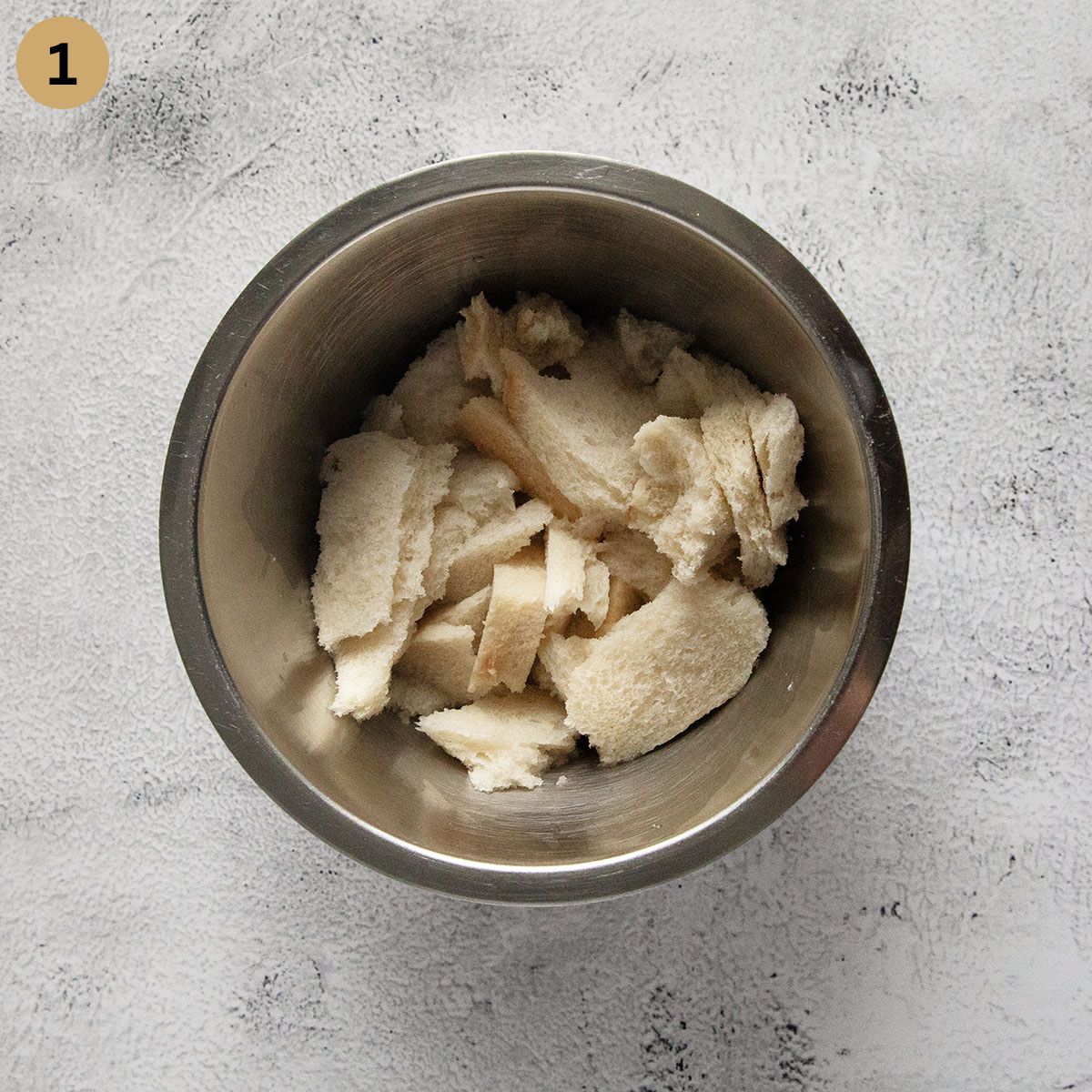 soaking white bread in a bowl needed to make meatballs. 