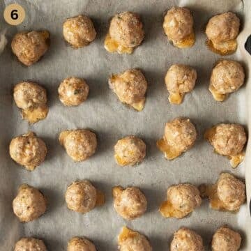 baked pork meatballs on a baking sheet.