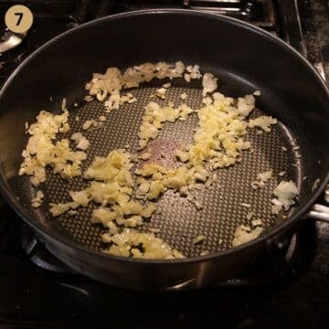 sauteing chopped onions in a large saucepan for making tomato sauce. 