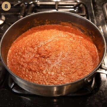 cooking tomato sauce for meatballs in a saucepan.