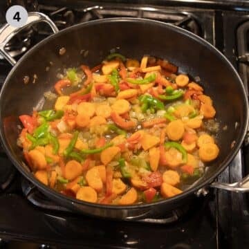 sauteing carrots, peppers and celeriac in a pan for making romanian rice.