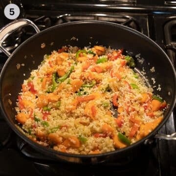 mixing raw rice into sauteed vegetables to make pilaf.
