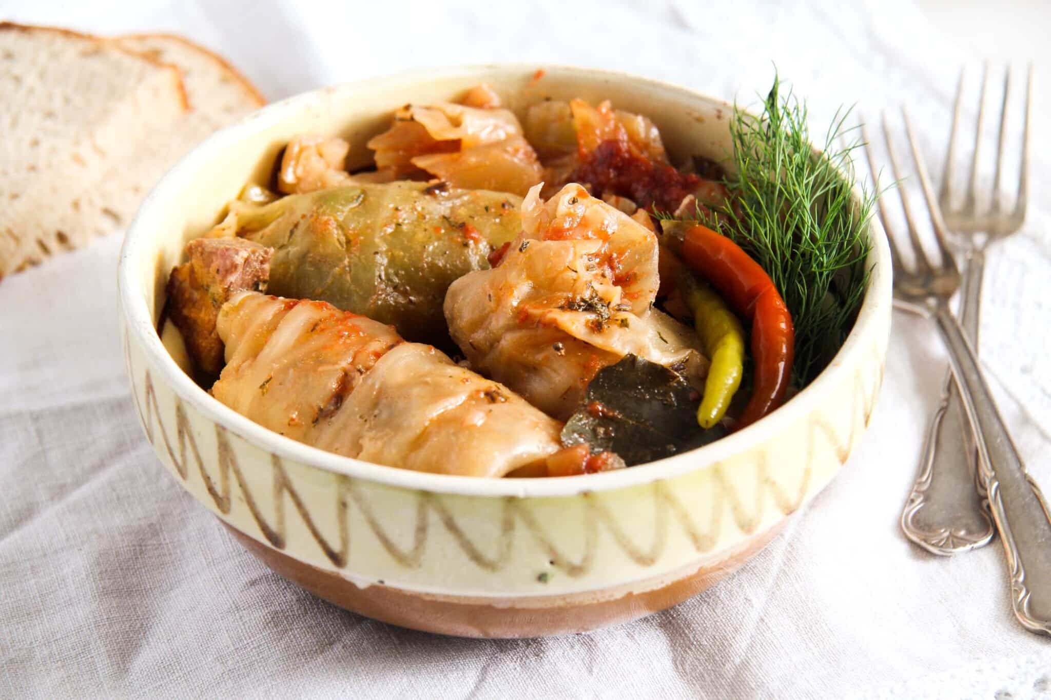 stuffed cabbage in a earthen dish.