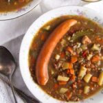 plate with german lentil soup with a sausage
