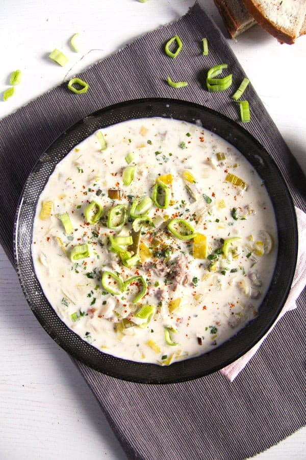 bowl with creamy cheese and leek soup