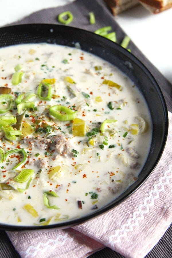 bowl with creamy cheese and leek soup