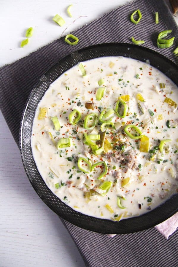 bowl with creamy cheese and leek soup