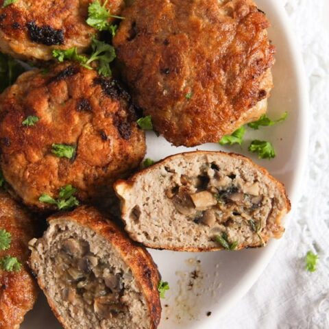 plate with large meatballs stuffed with mushrooms