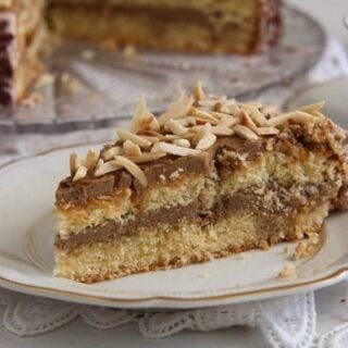 slice of cake with coffee buttercream on a small plate