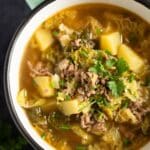 pinterest image with the title savoy cabbage soup.