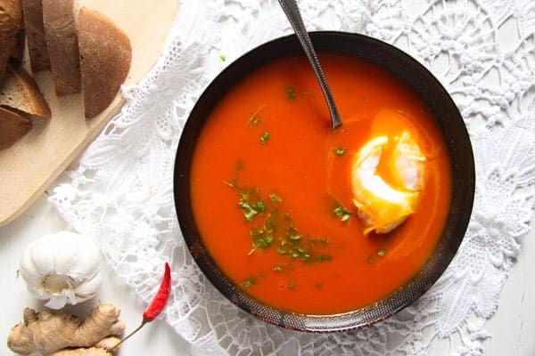 easy soup with tomatoes, ginger and eggs in a bowl.