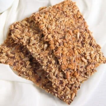 three pieces of homemade crispbread with seeds.